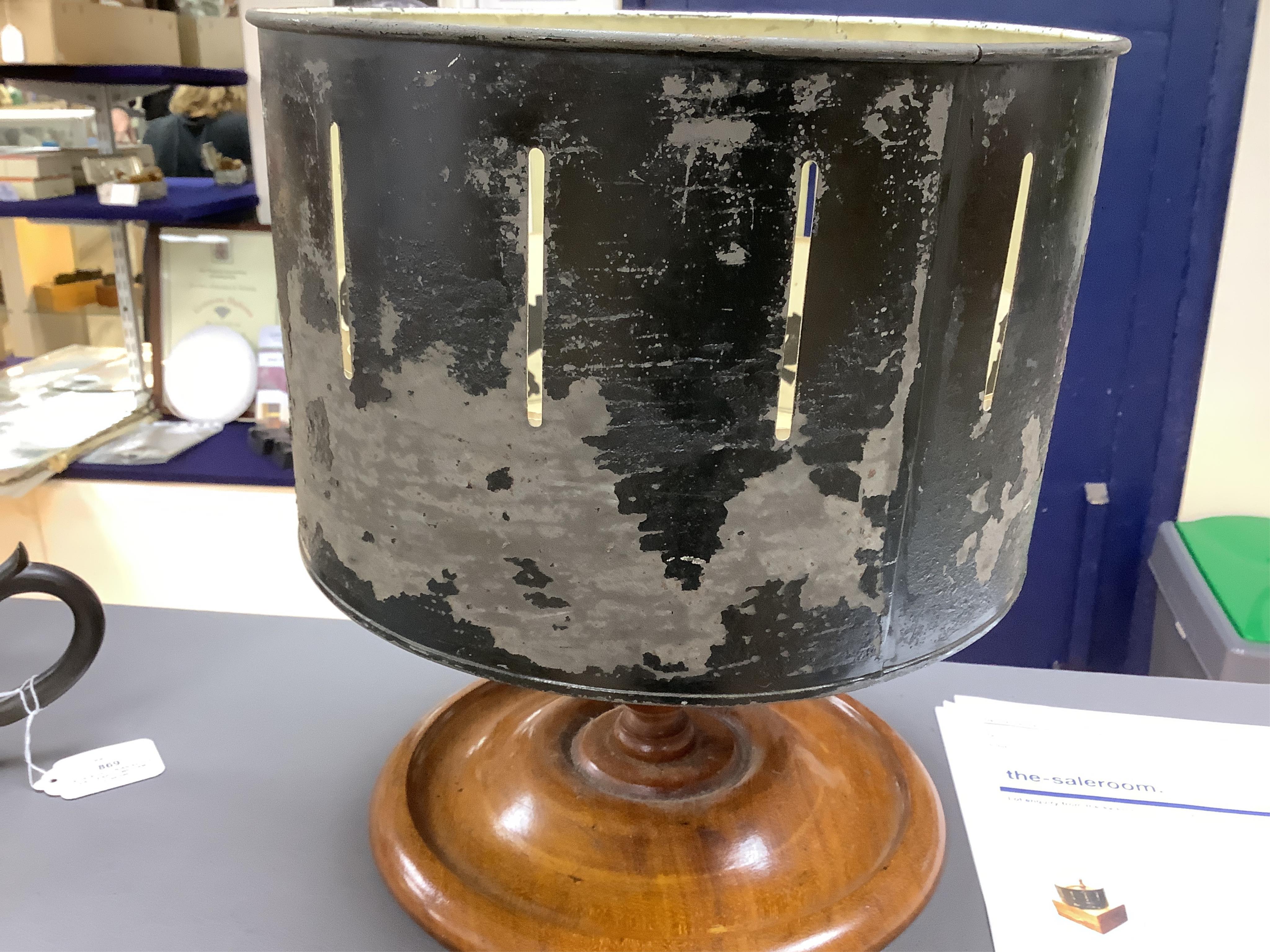 A late 19th century painted tin and mahogany zoetrope by the London Stereoscopic Co. with a number of paper inserts, diameter 30cm